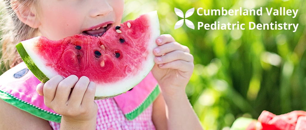 Kid eating watermelon, proper feeding practices for infants and toddlers