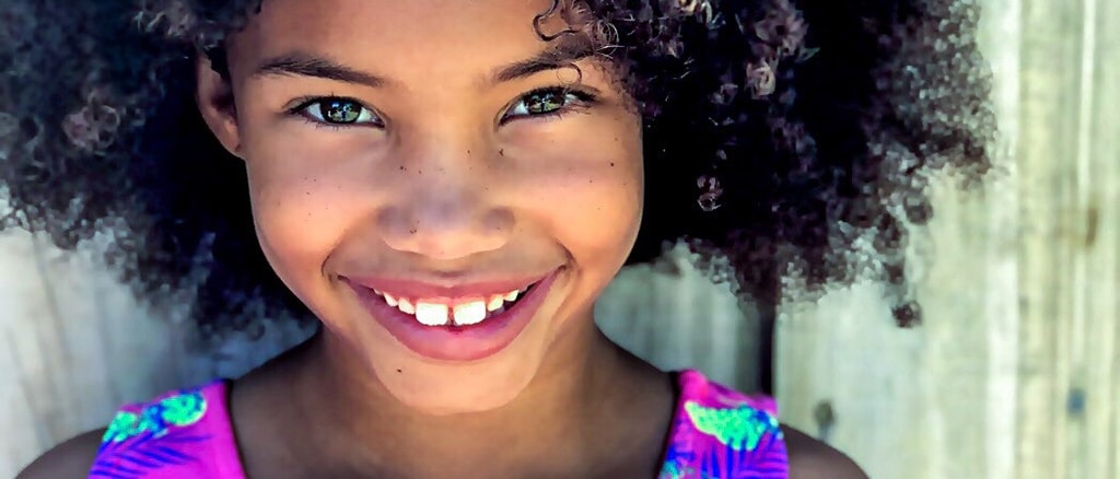 smiling girl, the best toothbrushes for kids