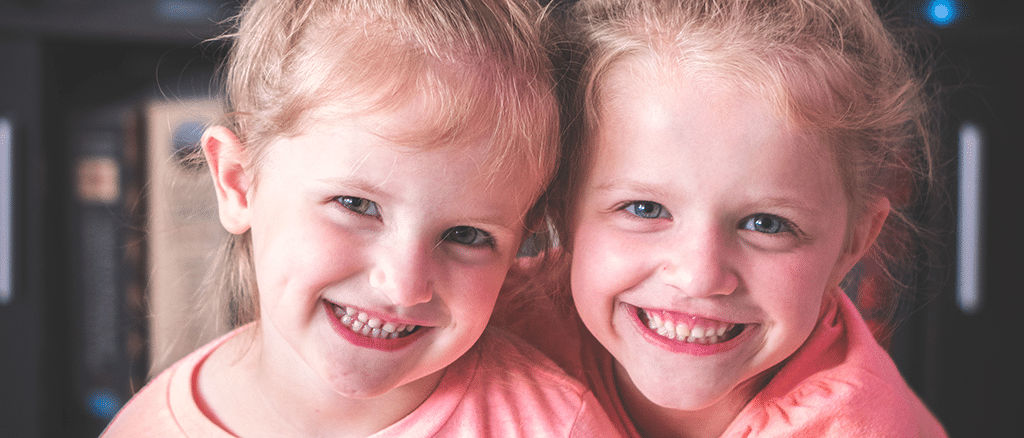 Smiling sisters, should kids get sealants